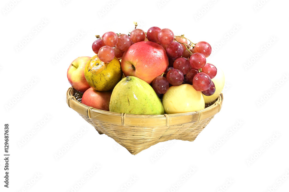 Fruits of other species in a bamboo basket isolated on white background.