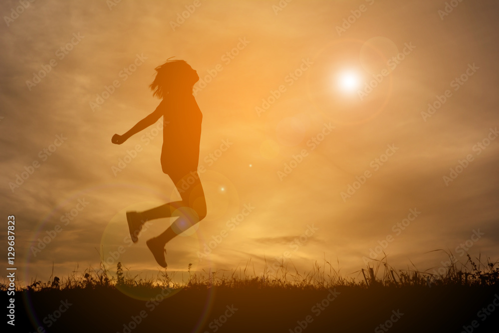 Silhouette of happy women playing  at the sky sunset