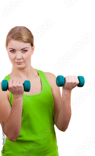 Woman exercising with dumbbells lifting weights