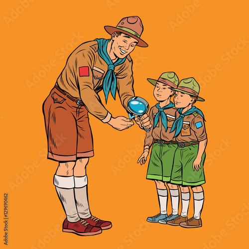 scoutmaster shows little insect to young scouts