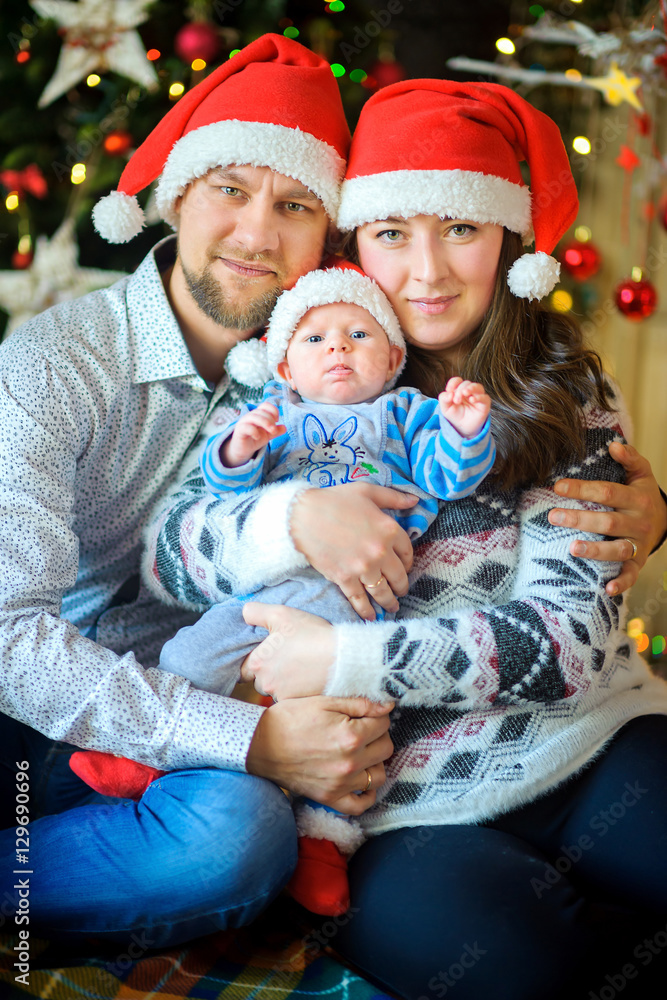 Happy family on a near a fir-tree Happy family on a near a fir-tree