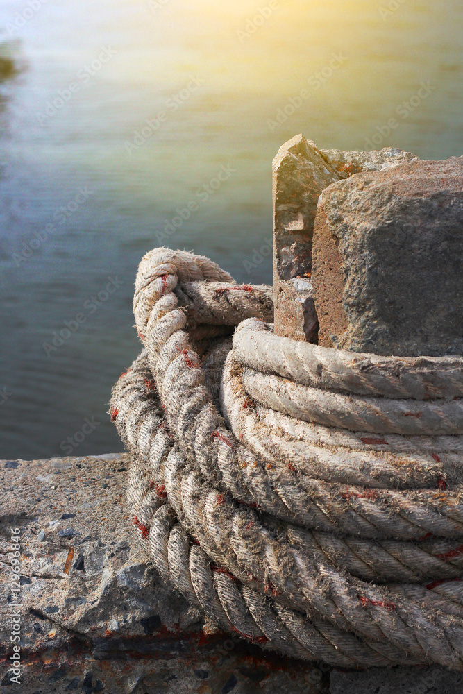 Fototapeta premium anchor rope tie up the stone pillar