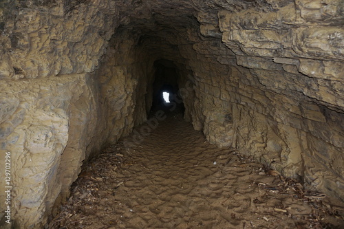 Inside a small tunnel in the rock connecting beaches of La Roche Percee to Turtle Bay, Bourail, Grande Terre, New Caledonia, south Pacific 