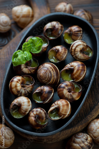 Close-up of a frying pan with bourgogne escargot snails