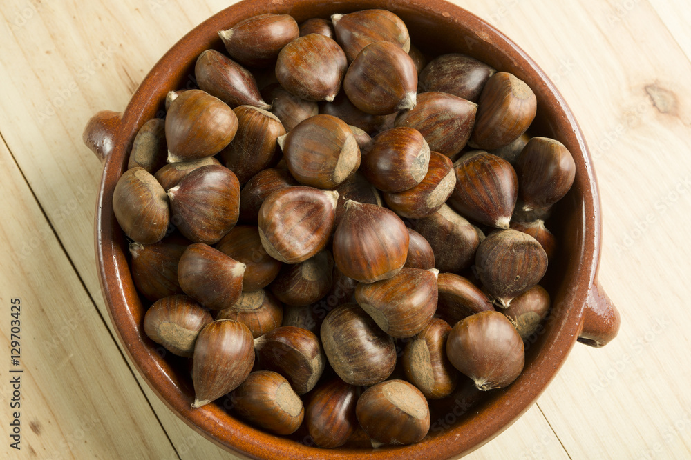 Chestnuts in an earthenware bowl.