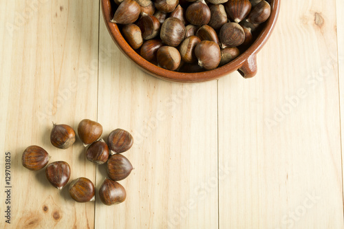 Chestnuts in an earthenware bowl.