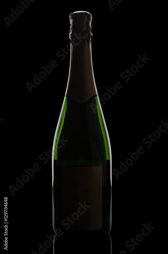 Champagne bottle on black backdrop