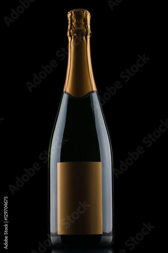 Champagne bottle on black background