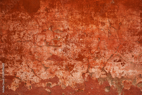 Rough surface concrete walls. Abstract red background. Concrete wall with cracks and scratches. Texture vintage stone surface