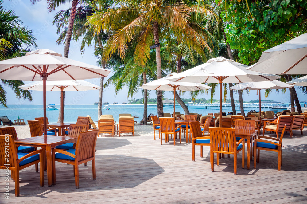 Cafe tables on a exotic tropical resort , Maldives islands