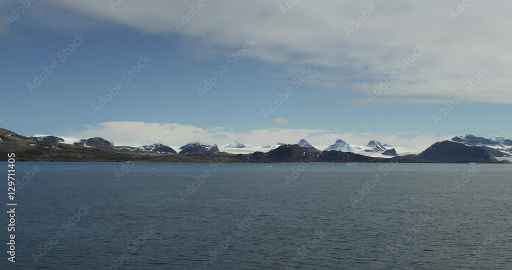 Wide Scenic of Bay with Glacier in Mountains From Ship Wide Scenic of Bay with Glacier in Mountains From Ship