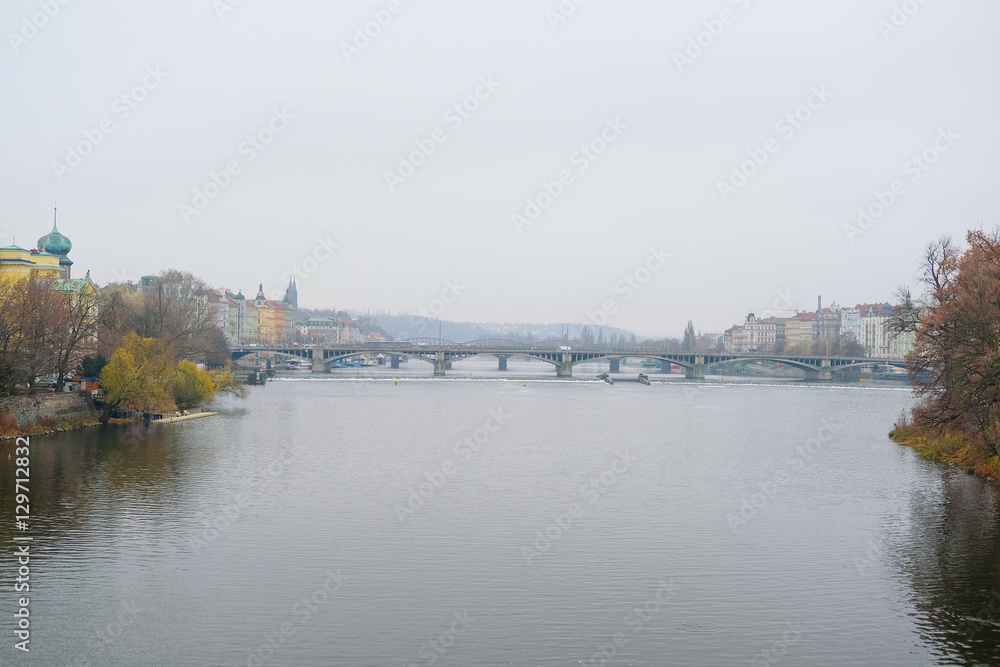 Panorama of an old Prague, bridges and embankment of Vitava river, Czechia
