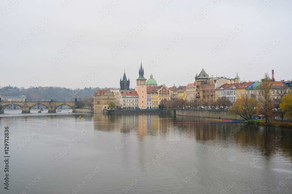 Prague,  Czechia - November, 24, 2016: Panorama of an old Prague, bridges and embankment of Vitava river, Czechia