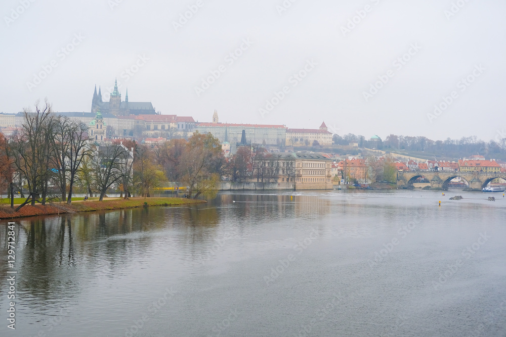 Panorama of an old Prague, bridges and embankment of Vitava river, Czechia