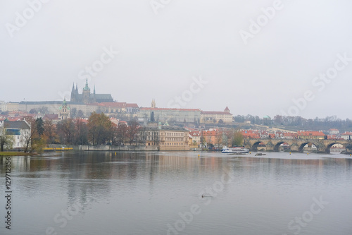 Prague, Czechia - November, 24, 2016: Panorama of an old Prague, bridges and embankment of Vitava river, Czechia