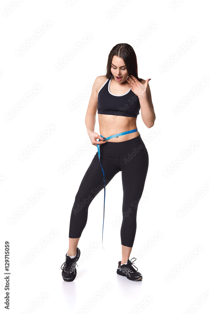Athletic fitness woman with meter helthy sport isolated white background black clothes Athletic fitness woman with meter helthy sport isolated white background black clothes