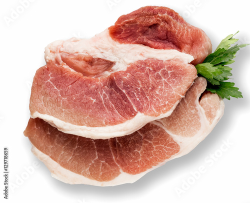 Meat, pork, raw pork chop, two portions, a top view, with parsley on a white background.