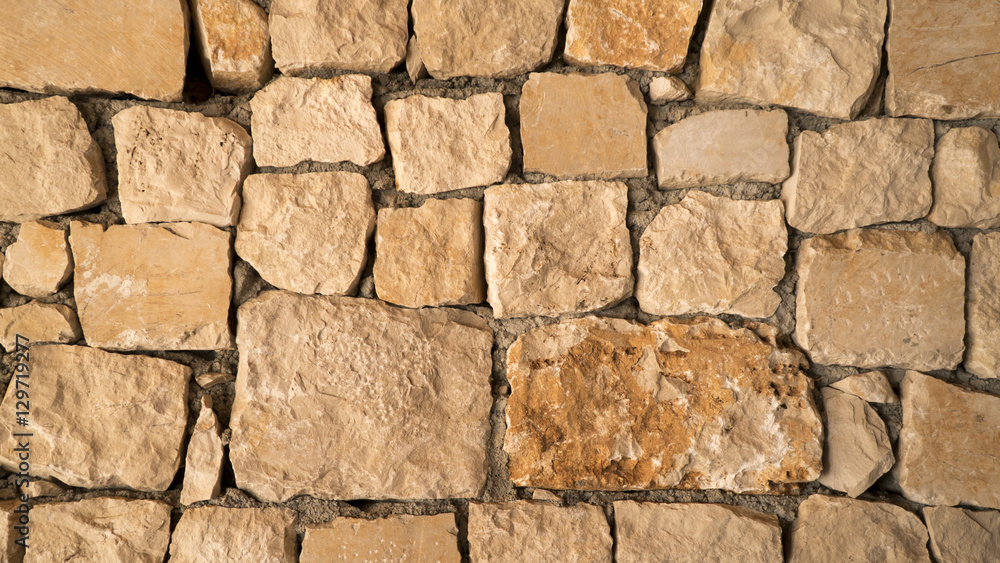 Brown sand stone texture, wall surface of old building Brown sand stone texture, wall surface of old building