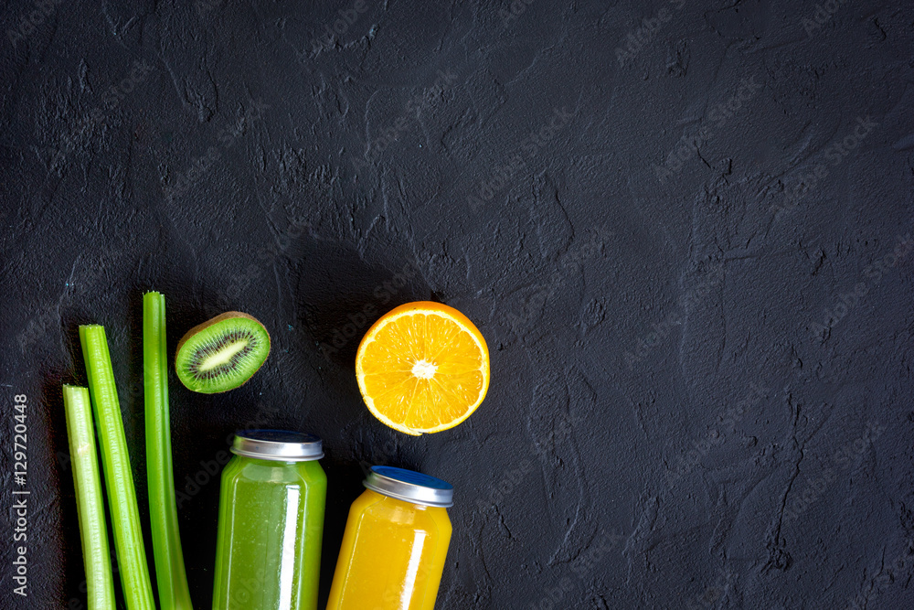 freshly squeezed juices for detox on dark background top view