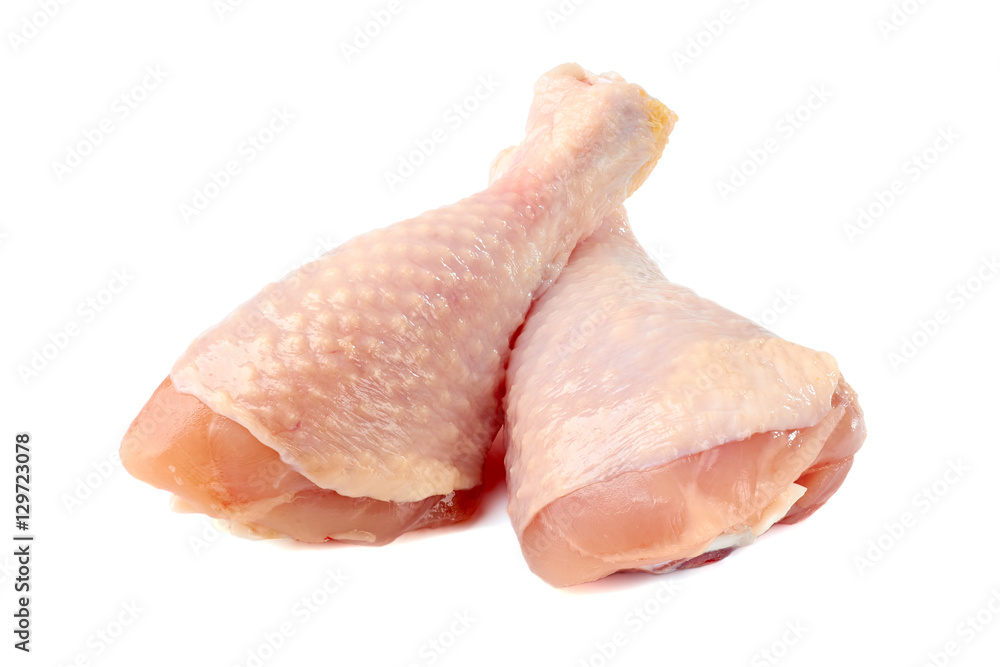 Raw chicken legs on white