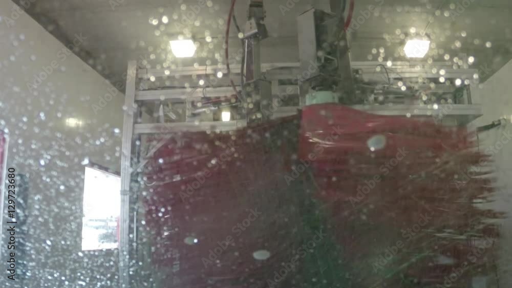 Driving through an automatic indoor car wash Driving through an automatic indoor car wash