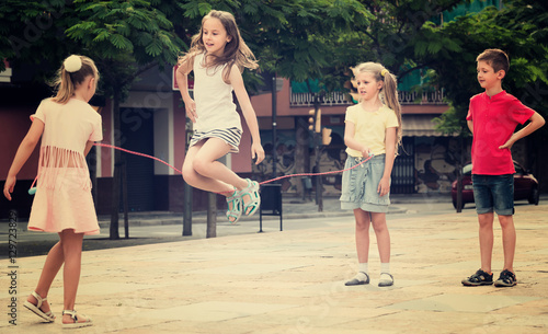 Fototapeta Naklejka Na Ścianę i Meble -  Kids skipping on  elastic rope