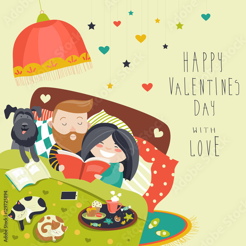 Happy couple in bed with cats and dog