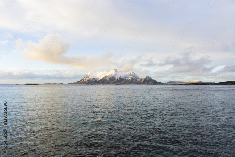 View of a Norwegian fjord with snowy mountains, Nordland, Norway View of a Norwegian fjord with snowy mountains, Nordland, Norway