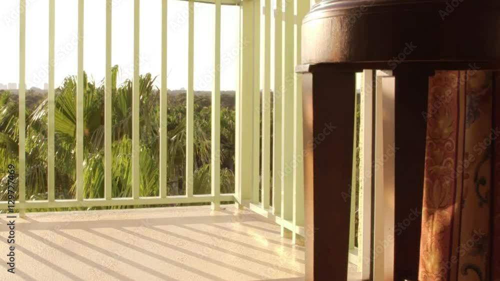 Warm tropical breeze blowing curtains on balcony Warm tropical breeze blowing curtains on balcony