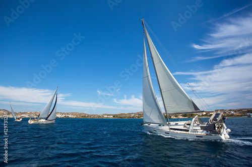 Luxury yachts at Sailing regatta. Sailing in wind through waves at Sea.