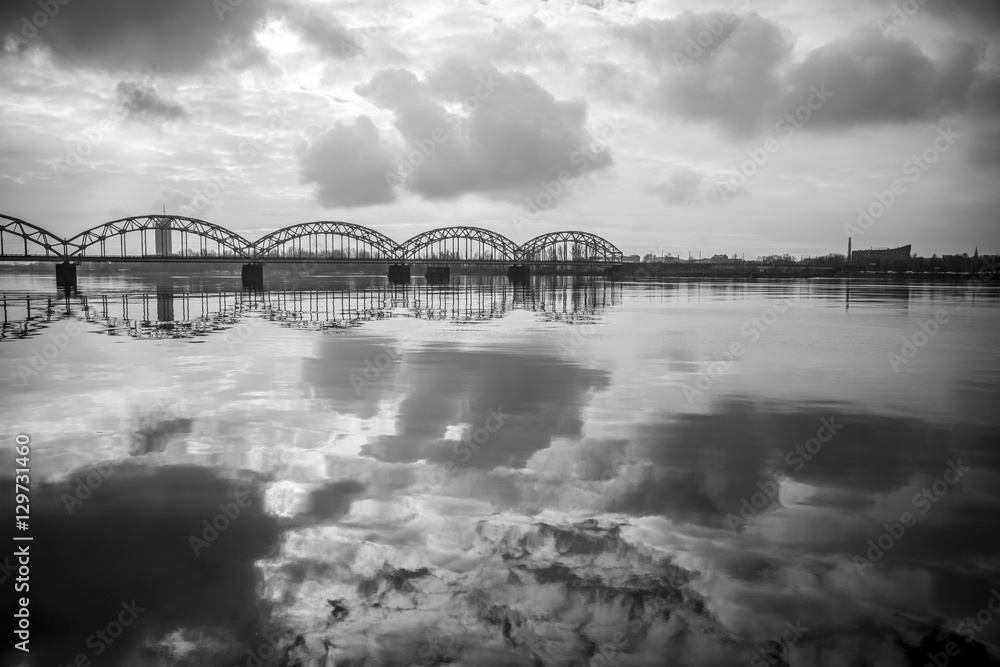 Picturesque view over the metal Railway Bridge over the Daugava river in Riga, Latvia