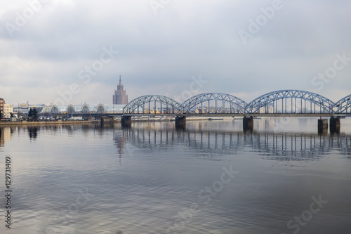 Picturesque view over the metal Railway Bridge over the Daugava river in Riga, Latvia