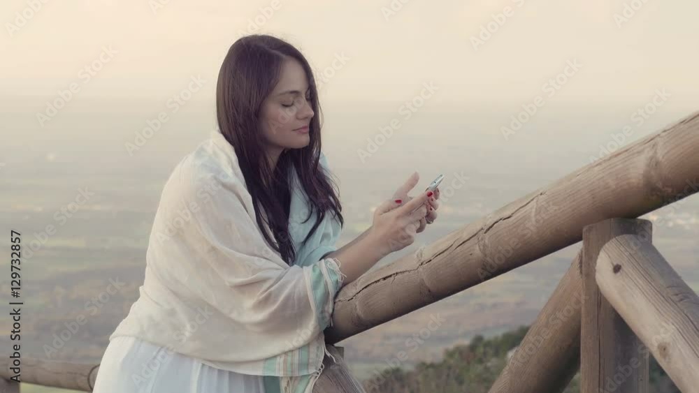 relaxed woman using smart phone: mobile phone, touch screen relaxed woman using smart phone: mobile phone, touch screen