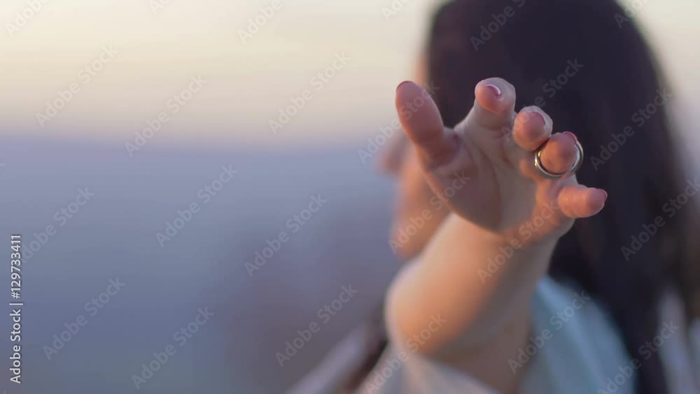 young woman in meditation opens her arms to the sky: relaxation, spirituality young woman in meditation opens her arms to the sky: relaxation, spirituality