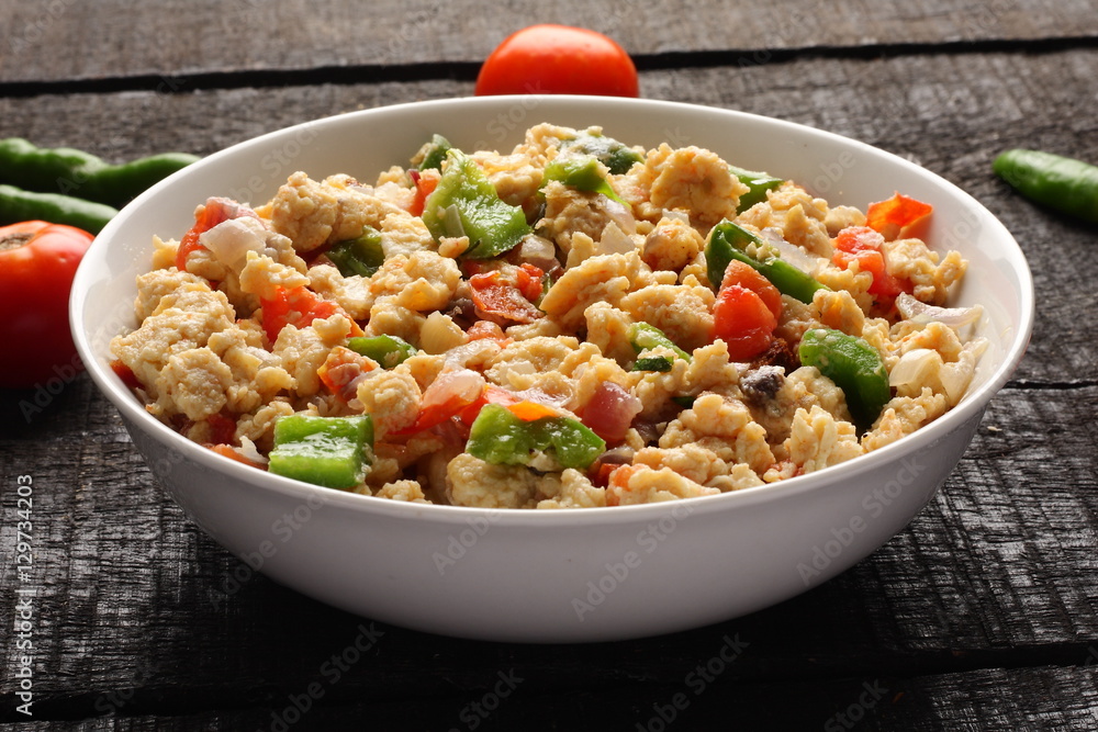 Bowl of scrambled eggs with vegetables Bowl of scrambled eggs with vegetables