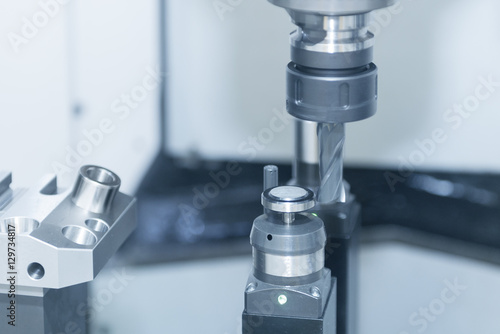 The flat end-mill cutting tool while measure tool diameter by automatic tool measurement