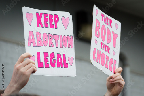 Pro-choice Planned Parenthood demonstration holding two signs