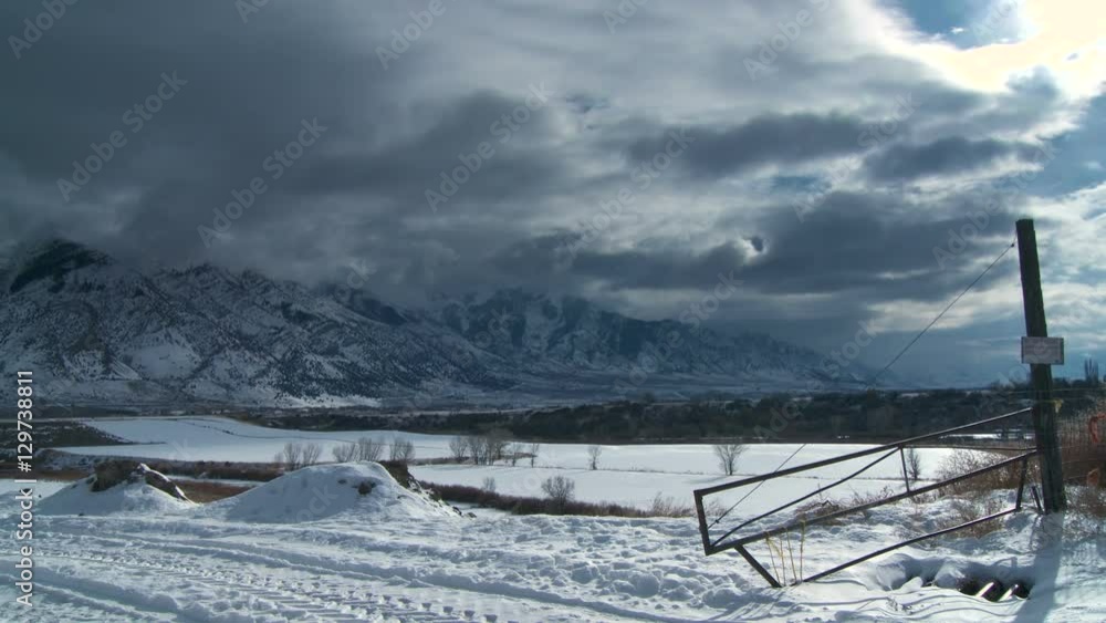 Wyoming Winter. An old desolate road leading up towards a snowy mountain in Wyoming. Wyoming Winter. An old desolate road leading up towards a snowy mountain in Wyoming.