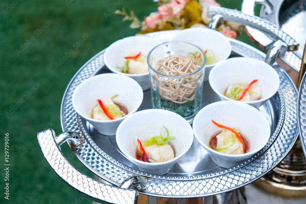 Sea bass steamed with soy sauce in white cup Sea bass steamed with soy sauce in white cup