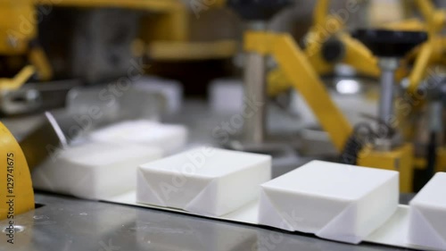 Packaging curd using machine. View of conveyor
