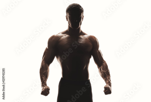 Obraz na płótnie Dark silhouette of a strong man on white background