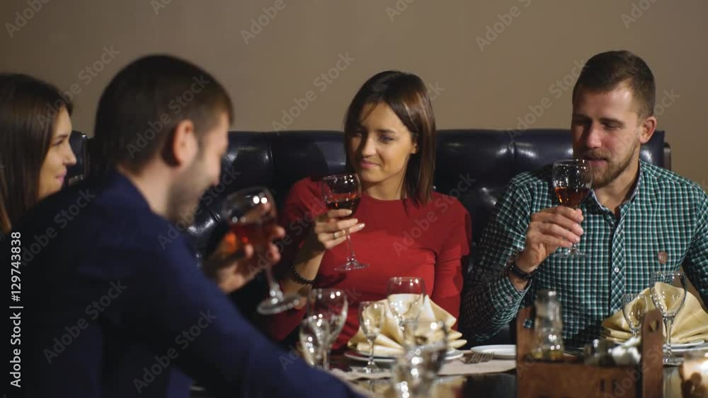 Friends at a restaurant drinking wine. Friends at a restaurant drinking wine.