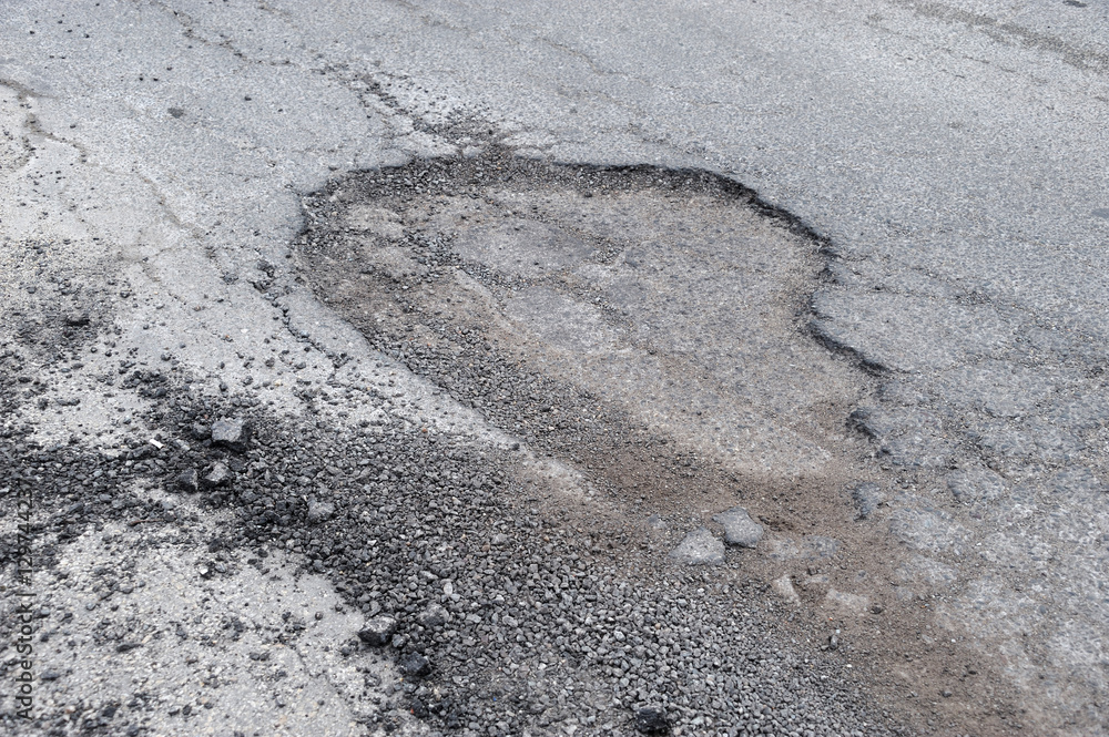 Fototapeta premium cracked asphalt road surface background