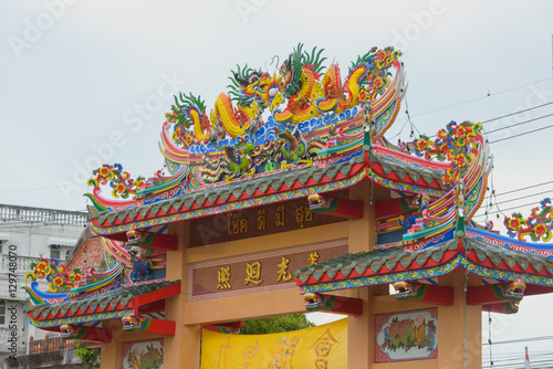 Decoration on roof at chinese temple in Thailand