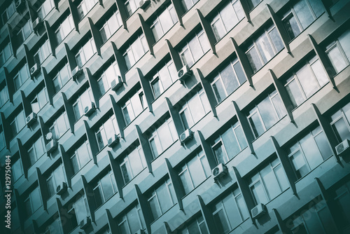 Wallpaper Mural Modern high-rise office building with a glass facade, background. Toned Torontodigital.ca