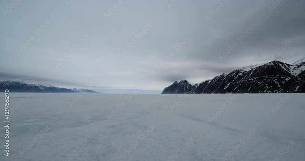 Time Lapse- Clouds over mountains and frozen sea ice Time Lapse- Clouds over mountains and frozen sea ice