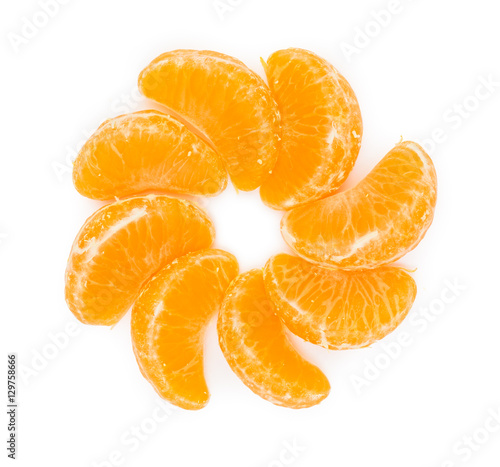 Pieces of orange tangerine or mandarin in sun form isolated