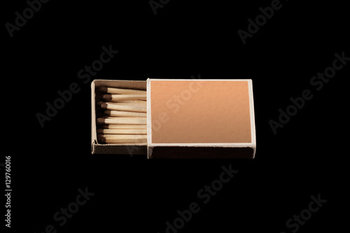 matchbox with matches isolated on a black background