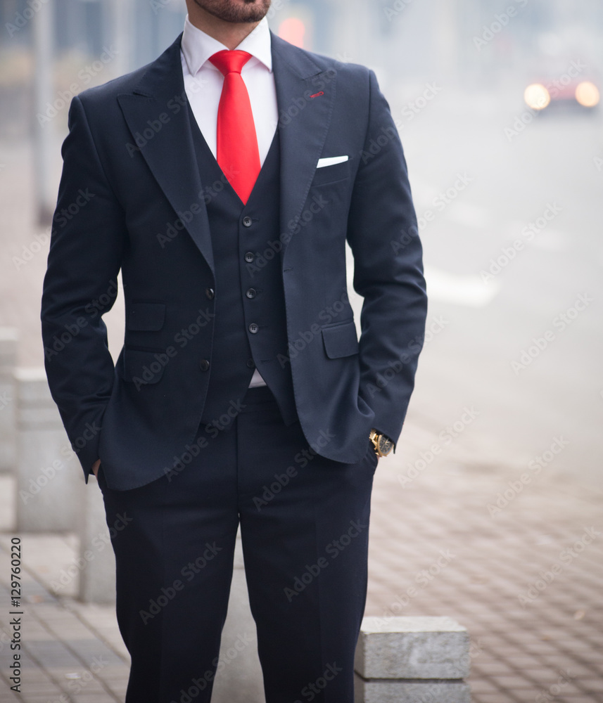 Manifold Creed i dag Male model in a black suit with a red tie Stock Photo | Adobe Stock