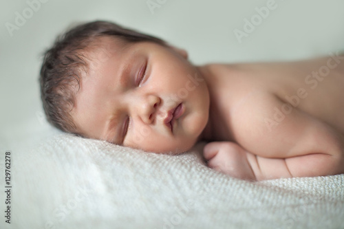 beautiful newborn sleeping baby. close-up portrait